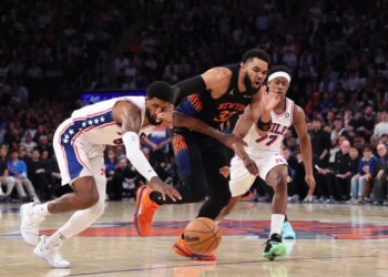 Philadelphia 76ers player Paul George steals the ball from New York Knicks player Karl-Anthony Towns during Game 2 of the Eastern Conference Semifinals.