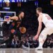 New York Knicks guard Jalen Brunson drives down court against Cleveland Cavaliers forward Dean Wade.