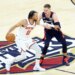 New York Knicks guard Jalen Brunson (11) drives down court as Cleveland Cavaliers guard Sam Merrill (5) gives chase during the second quarter.