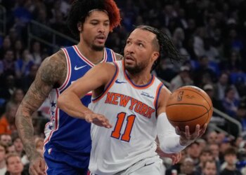 Jalen Brunson is defended by Kelly Oubre Jr. during the Knicks' Game 1 blowout win over the 76ers on May 4, 2026 at the Garden.