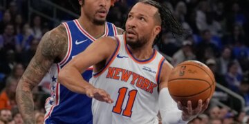 Jalen Brunson is defended by Kelly Oubre Jr. during the Knicks' Game 1 blowout win over the 76ers on May 4, 2026 at the Garden.