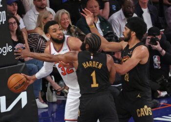 Cleveland Cavaliers guard James Harden #1 and Cleveland Cavaliers center Jarrett Allen #31 double team New York Knicks center Karl-Anthony Towns #32 during the second quarter.
