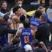 New York Knicks center Mitchell Robinson #23 fighting with Atlanta Hawks guard Dyson Daniels #5.