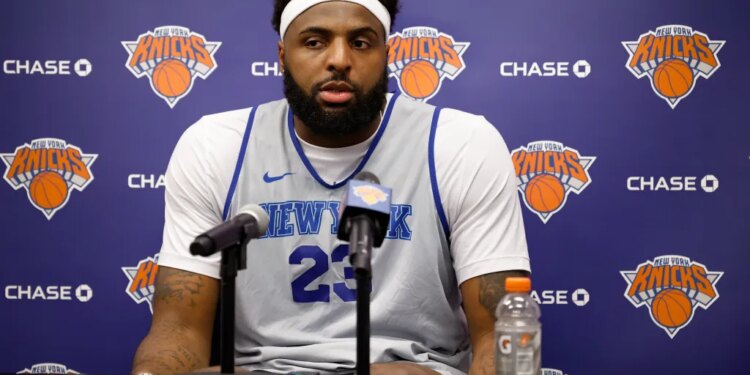 Mitchell Robinson speaking at a press conference after New York Knicks practice.