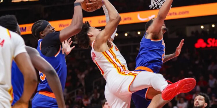 Ariel Hukporti (left) blocks Jalen Johnson's shot during the fourth quarter of the Knicks' 140-89 Game 6 series-clinching win over the Hawks on April 30, 2026 in Atlanta.
