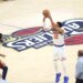 Karl-Anthony Towns (32) shooting a three-point shot over Jarrett Allen (31).