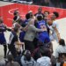 New York Knicks center Mitchell Robinson fighting with Atlanta Hawks guard Dyson Daniels during an NBA playoff game.