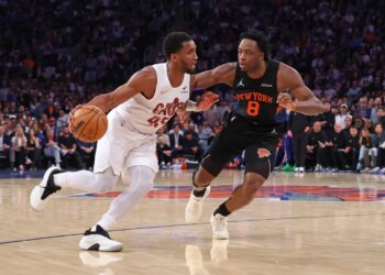 Cleveland Cavaliers guard Donovan Mitchell dribbles against New York Knicks forward Og Anunoby.