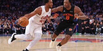 Cleveland Cavaliers guard Donovan Mitchell dribbles against New York Knicks forward Og Anunoby.