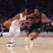 Cleveland Cavaliers guard Donovan Mitchell dribbles against New York Knicks forward Og Anunoby.