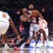 Cleveland Cavaliers guard Donovan Mitchell drives to the basket as New York Knicks guard Mikal Bridges defends.