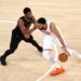 New York Knicks center Karl-Anthony Towns drives to the basket as Cleveland Cavaliers guard Donovan Mitchell defends during Game 1 of the Eastern Conference Finals.