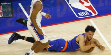 New York Knicks guard Landry Shamet (44) falls with the ball as Philadelphia 76ers guard Tyrese Maxey (0) gives chase during the second quarter.