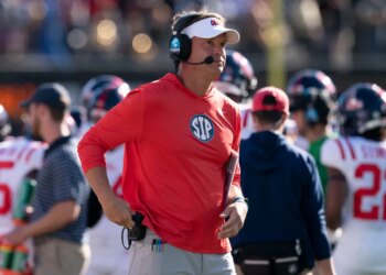 Mississippi head coach Lane Kiffin looking at the scoreboard during a game against Vanderbilt.