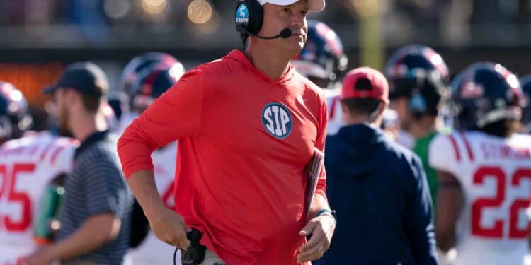 Mississippi head coach Lane Kiffin looking at the scoreboard during a game against Vanderbilt.