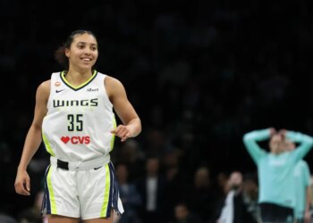Dallas Wings’ Azzi Fudd (35) reacts after hitting a three-point basket.