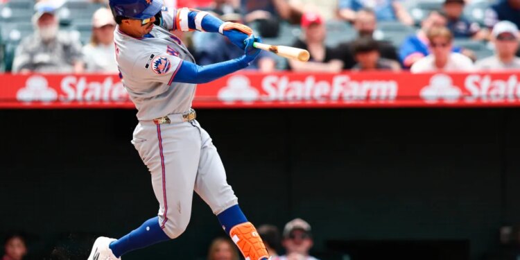 Mark Vientos of the New York Mets hitting a home run.