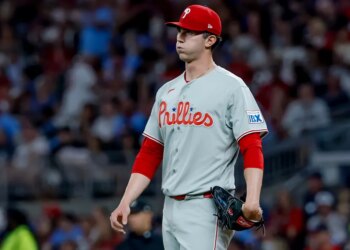 Philadelphia Phillies starting pitcher Andrew Painter (24) reacts after giving up runs to the Atlanta Braves during the sixth inning of a baseball game, Friday, April 24, 2026, in Atlanta.