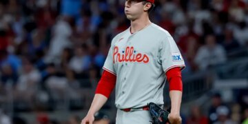 Philadelphia Phillies starting pitcher Andrew Painter (24) reacts after giving up runs to the Atlanta Braves during the sixth inning of a baseball game, Friday, April 24, 2026, in Atlanta.