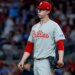 Philadelphia Phillies starting pitcher Andrew Painter (24) reacts after giving up runs to the Atlanta Braves during the sixth inning of a baseball game, Friday, April 24, 2026, in Atlanta.
