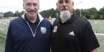 Massapequa Soccer Club director Paul Bigilin (right) with Wrexham FC's John Fitzgerald in 2025.