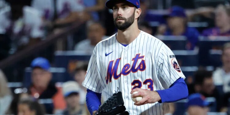 New York Mets pitcher David Peterson reacts after Cincinnati Reds left fielder JJ Bleday scores.