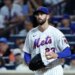 New York Mets pitcher David Peterson reacts after Cincinnati Reds left fielder JJ Bleday scores.