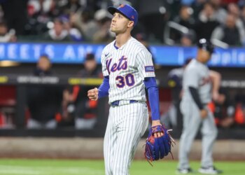 New York Mets relief pitcher Luke Weaver (30) gestures after retiring the side in the eighth inning against the