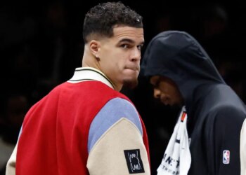 Brooklyn Nets player Michael Porter Jr. on the bench during a game.