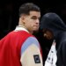 Brooklyn Nets player Michael Porter Jr. on the bench during a game.