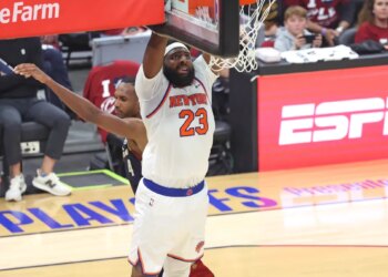 New York Knicks center Mitchell Robinson (23) slams the ball during the third quarter.