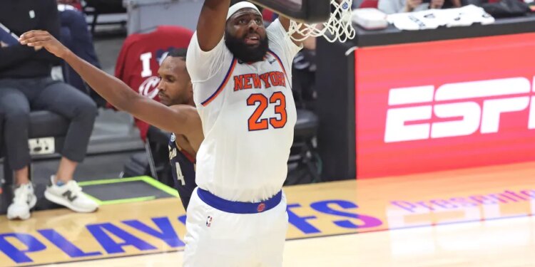 New York Knicks center Mitchell Robinson (23) slams the ball during the third quarter.