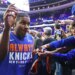 Miles McBride #2 of the New York Knicks signing autographs for fans at the Xfinity Mobile Arena.