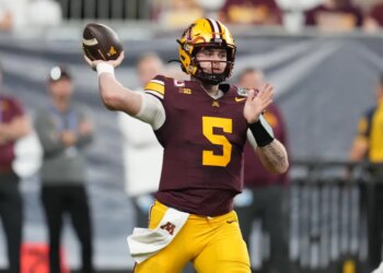 Minnesota quarterback Drake Lindsey (5) throws a pass.