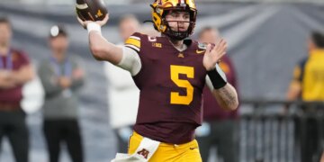 Minnesota quarterback Drake Lindsey (5) throws a pass.