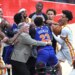 New York Knicks center Mitchell Robinson fighting with Atlanta Hawks guard Dyson Daniels during an NBA Playoffs game.