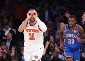 New York Knicks guard Jalen Brunson (11) reacts as he runs down court after hitting a three-point shot during the third quarter.