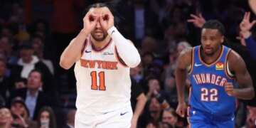 New York Knicks guard Jalen Brunson (11) reacts as he runs down court after hitting a three-point shot during the third quarter.