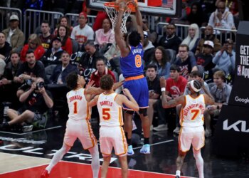 New York Knicks forward Og Anunoby (8) slams the ball during a game against the Atlanta Hawks.