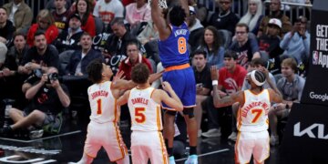 New York Knicks forward Og Anunoby (8) slams the ball during a game against the Atlanta Hawks.