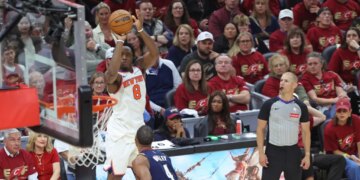 New York Knicks forward Og Anunoby #8 shooting a 3-point shot against the Cleveland Cavaliers.