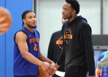OG Anunoby slaps hands with Miles McBride during Knicks' practice on May 13, 2026 at the team's training facility in Tarrytown, N.Y.