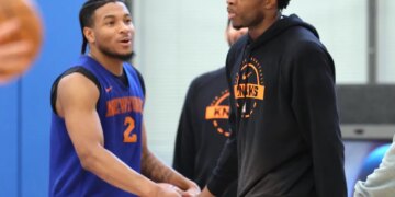 OG Anunoby slaps hands with Miles McBride during Knicks' practice on May 13, 2026 at the team's training facility in Tarrytown, N.Y.