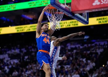 Landry Shamet slams home a dunk past Tyrese Maxey during the Knicks' Game 3 win over the 76ers.