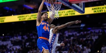 Landry Shamet slams home a dunk past Tyrese Maxey during the Knicks' Game 3 win over the 76ers.