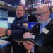 Specialist Anthony Matesic and trader Fred Demarco working on the floor of the New York Stock Exchange.