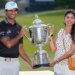 Aaron Rai and Gaurika Bishnoi holding the Wanamaker Trophy after Rai's PGA Championship golf tournament win.