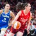Indiana Fever guard Caitlin Clark (22) dribbles the ball while Dallas Wings guard Paige Bueckers (5) defends in the first half at Gainbridge Fieldhouse.