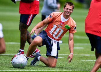 New England Patriots quarterback Drake Maye smiles during NFL football practice, Wednesday, May 27, 2026, in Foxborough, Mass.