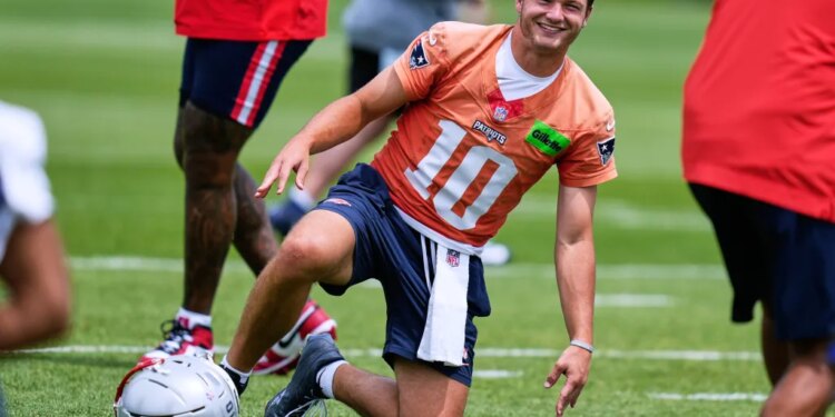 New England Patriots quarterback Drake Maye smiles during NFL football practice, Wednesday, May 27, 2026, in Foxborough, Mass.